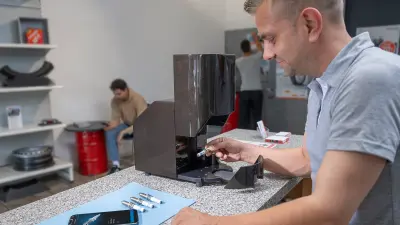 Workshop employee checking parts received with Origify